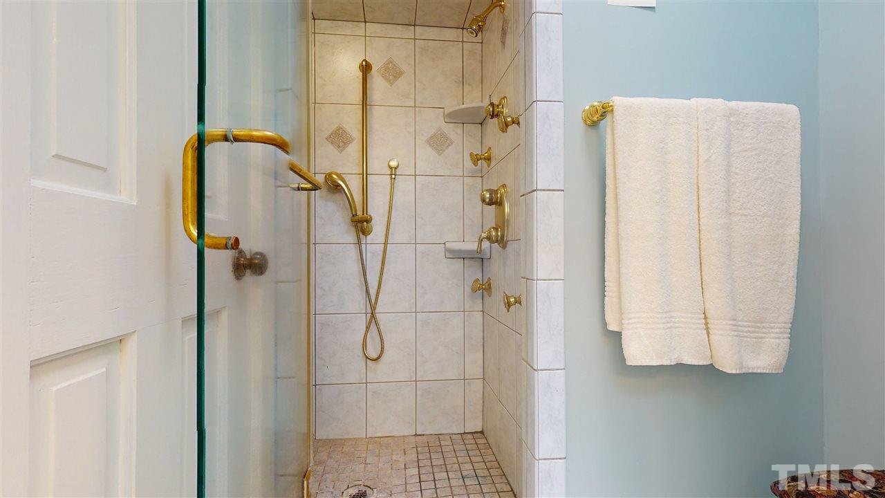 7010 Farmdale Road Raleigh, NC 27610 - Photo 25 of 30 a bathroom with a shower