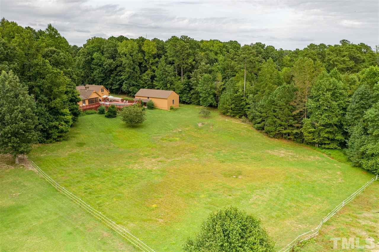7010 Farmdale Road Raleigh, NC 27610 - Photo 5 of 30 a yard with lake view