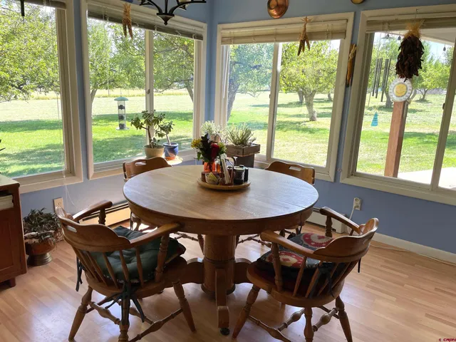 a view of a dining room with furniture window and outside view