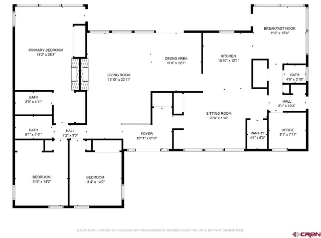 a picture of a open kitchen with a white wall and sign