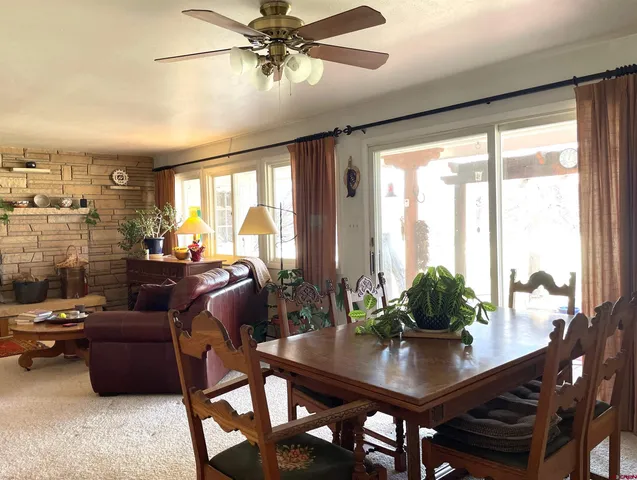 a view of a livingroom with furniture and window