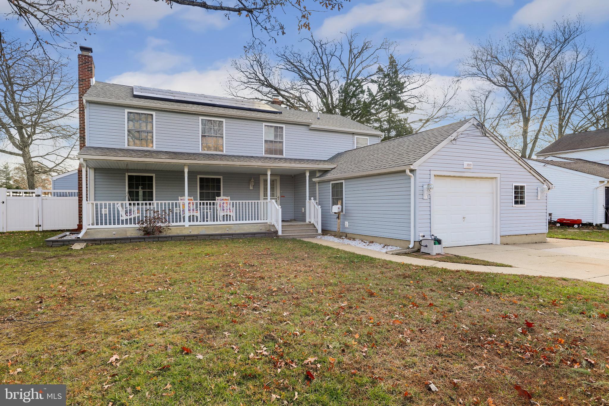 Charming two-story home with spacious yard.