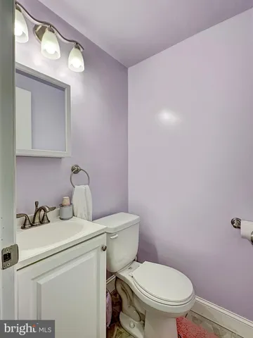 a spacious bedroom with a bed and a window