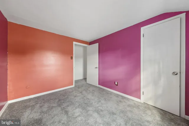 a bathroom with a sink vanity mirror and toilet
