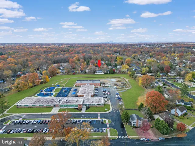 a view of a two chairs in front of a house