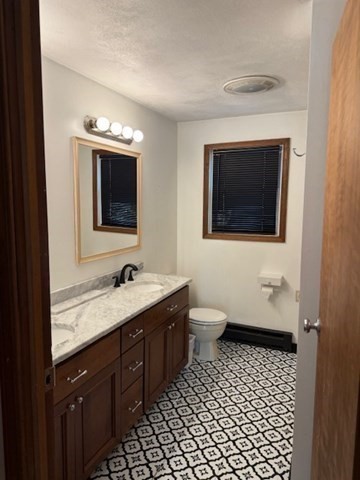 30 Groton Road Shirley, MA 01464 - Photo 12 of 25 a bathroom with a toilet sink double vanity and mirror