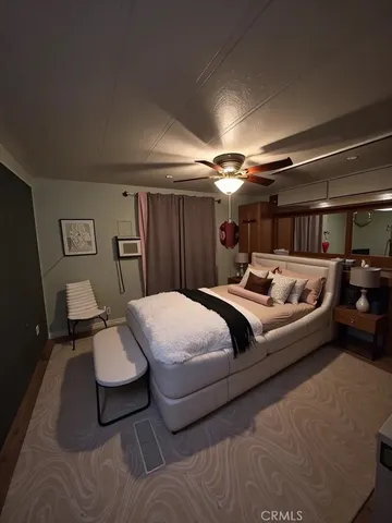 a bedroom with a bed and furniture