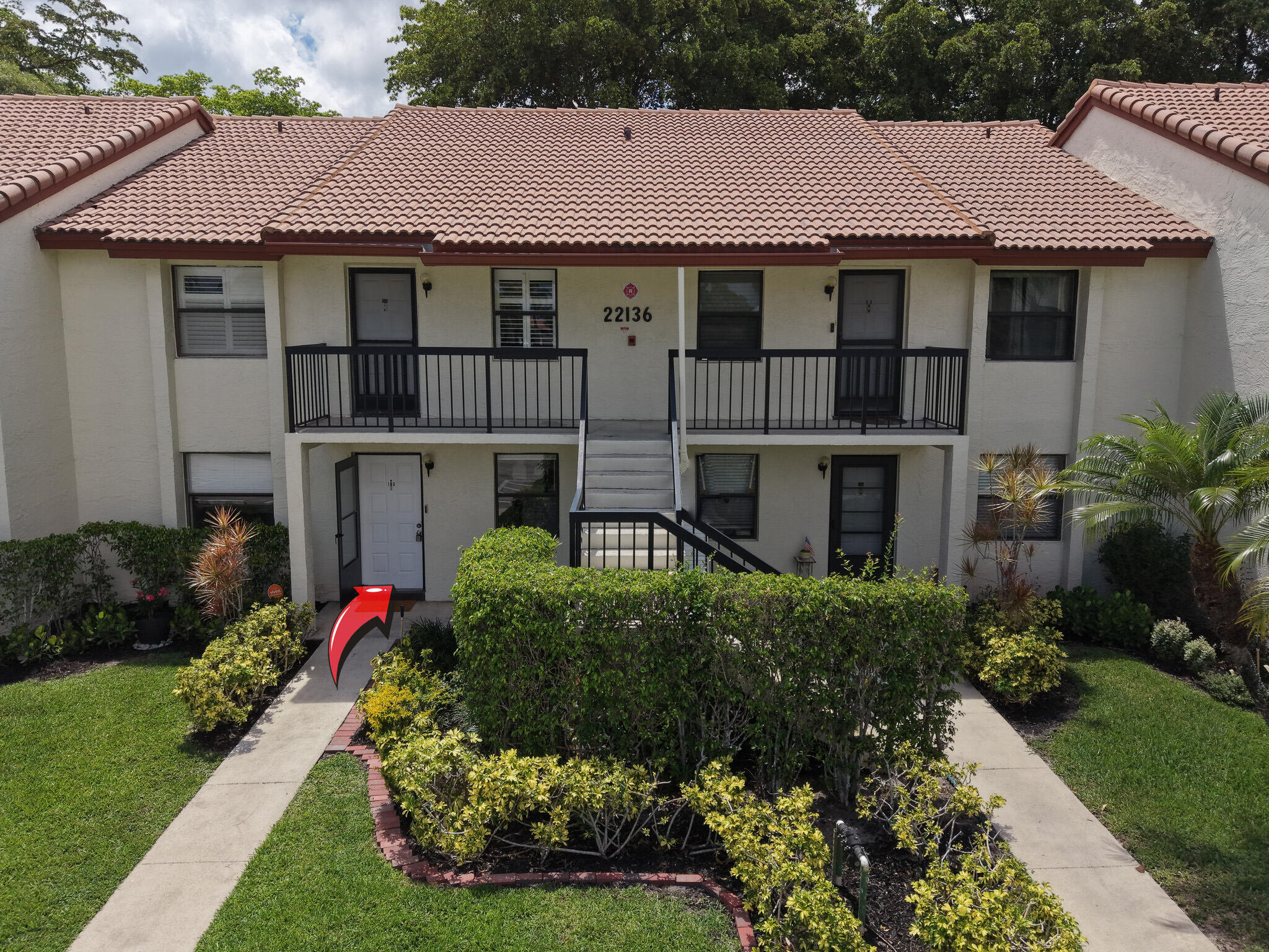 22136 Palms Way, Unit 103 Boca Raton, FL 33433 - Photo 2 of 42 a house view with a garden space