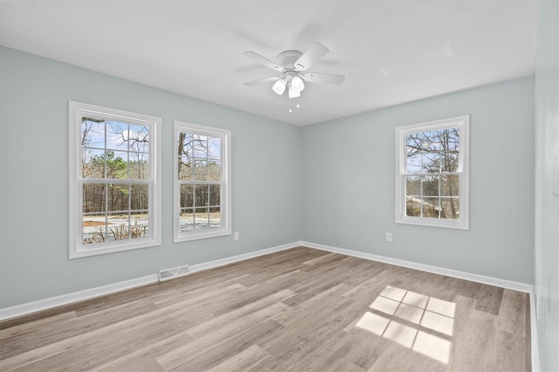 326 Kenneth Street Walhalla, SC 29691 - Photo 17 of 30 This airy room features durable flooring and multiple windows, creating a bright and inviting atmosphere.