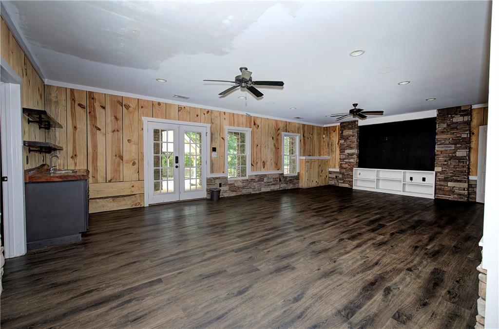 561 Holland Road Dallas, GA 30157 - Photo 31 of 48 a view of a livingroom with furniture wooden floor and windows