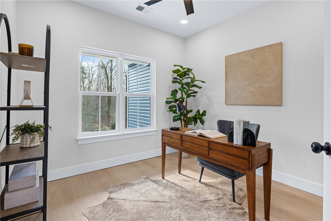 322 Oconee Avenue Westminster, SC 29693 - Photo 17 of 43 This bright and airy room offers a versatile space, perfect for work or quiet contemplation.