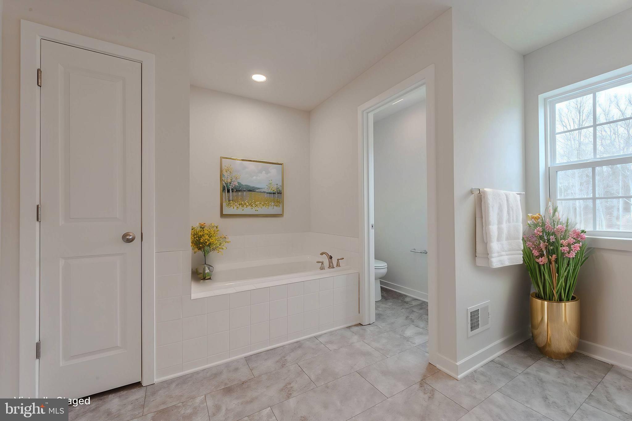 422 Bellflower Way, Unit CHALFONT Townsend, DE 19734 - Photo 14 of 21 a bathroom with a bathtub and a shower