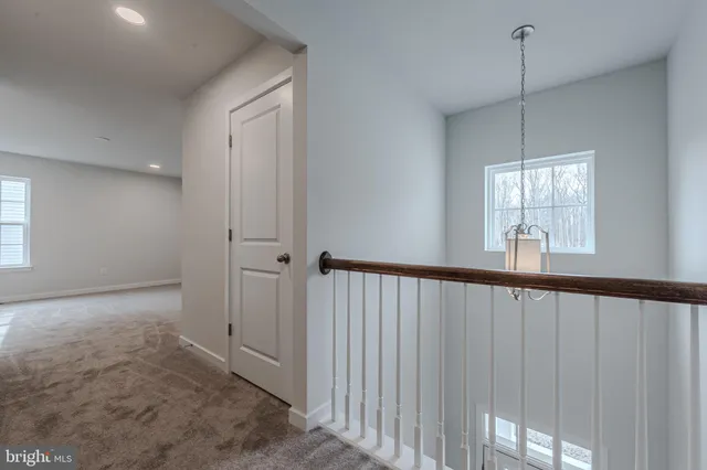 a view of a hallway with windows