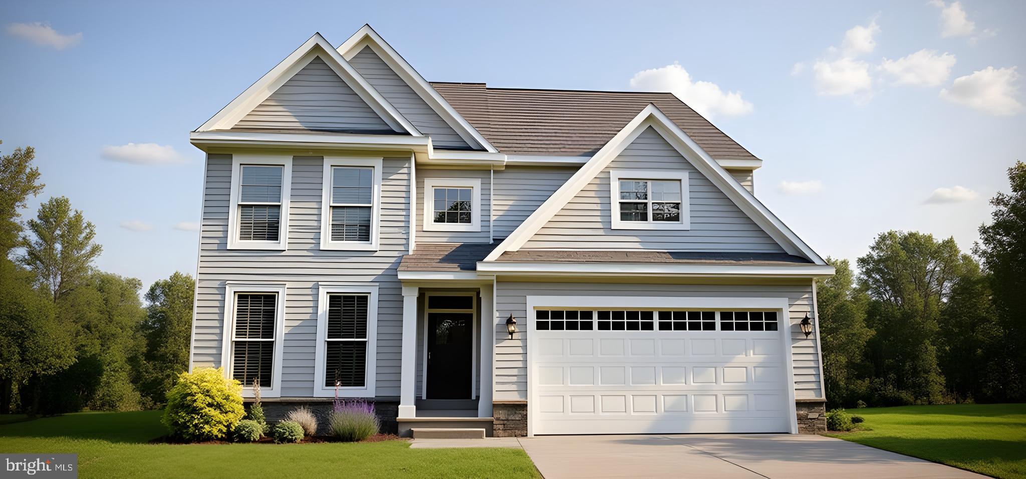 422 Bellflower Way, Unit CHALFONT Townsend, DE 19734 - Photo 3 of 21 a front view of a house with a yard and garage