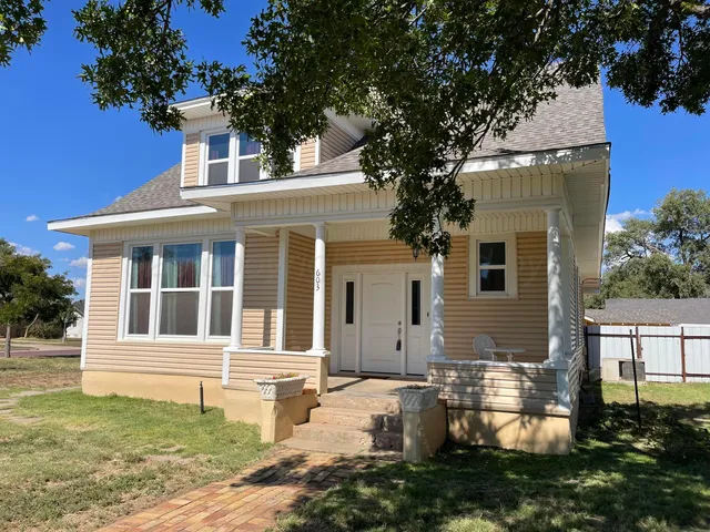 a bedroom with a bed and cabinets