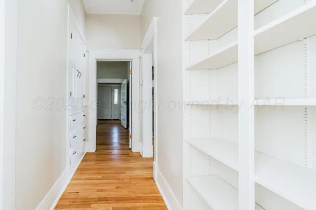 a view of a room with rack and wooden floor