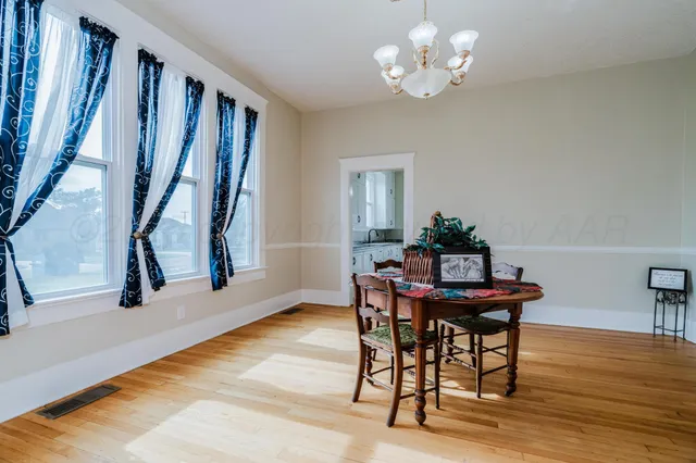 a front view of a house with a fountain