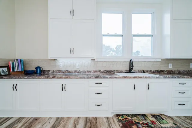 a view of a room with wooden floor and stairs