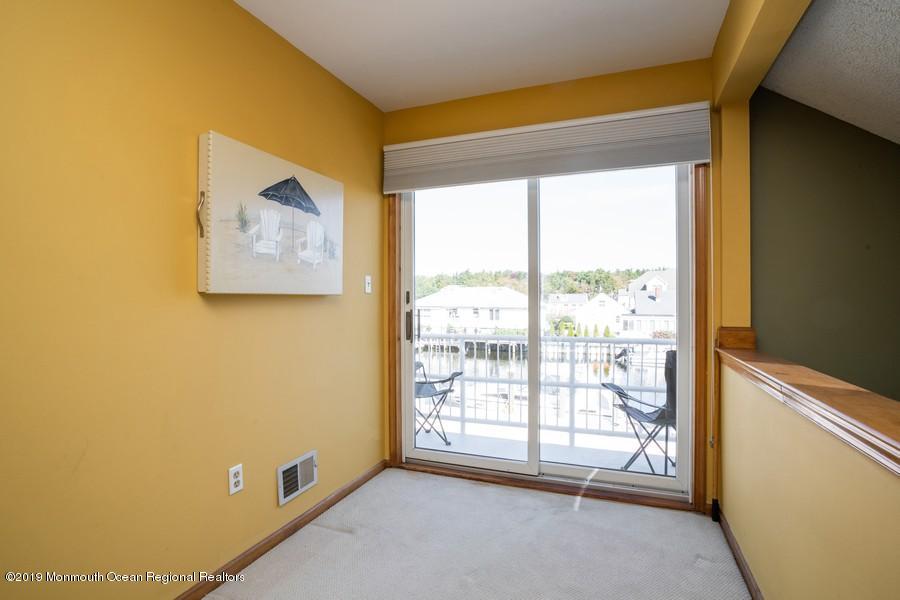 140 Cedar Run Road Bayville, NJ 08721 - Photo 8 of 18 a view of an empty room with a window