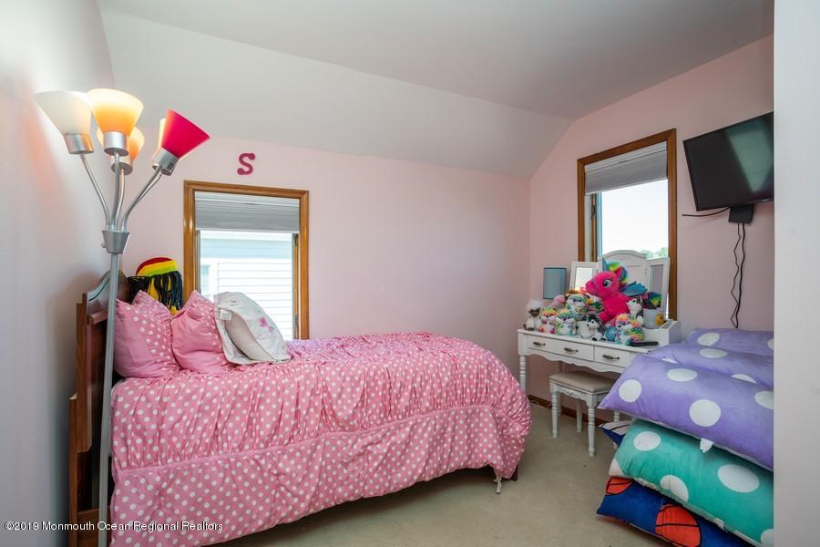 140 Cedar Run Road Bayville, NJ 08721 - Photo 9 of 18 a bedroom with a bed and a dresser