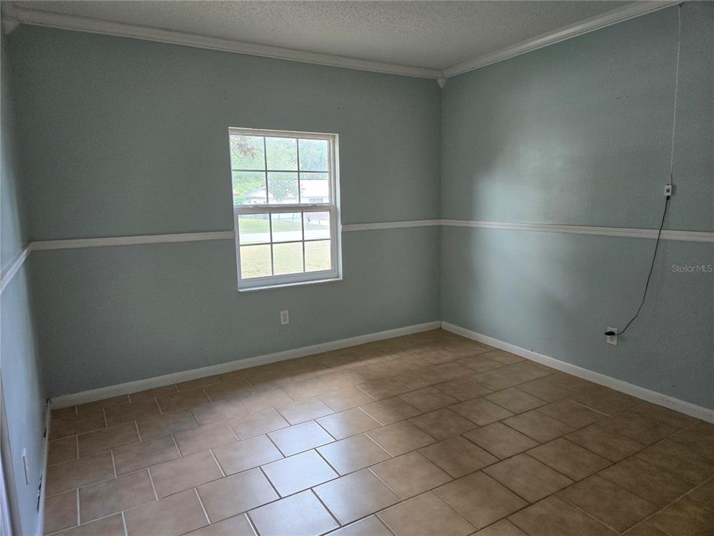 19 Spring Dr Place Ocala, FL 34472 - Photo 17 of 29 an empty room with a window
