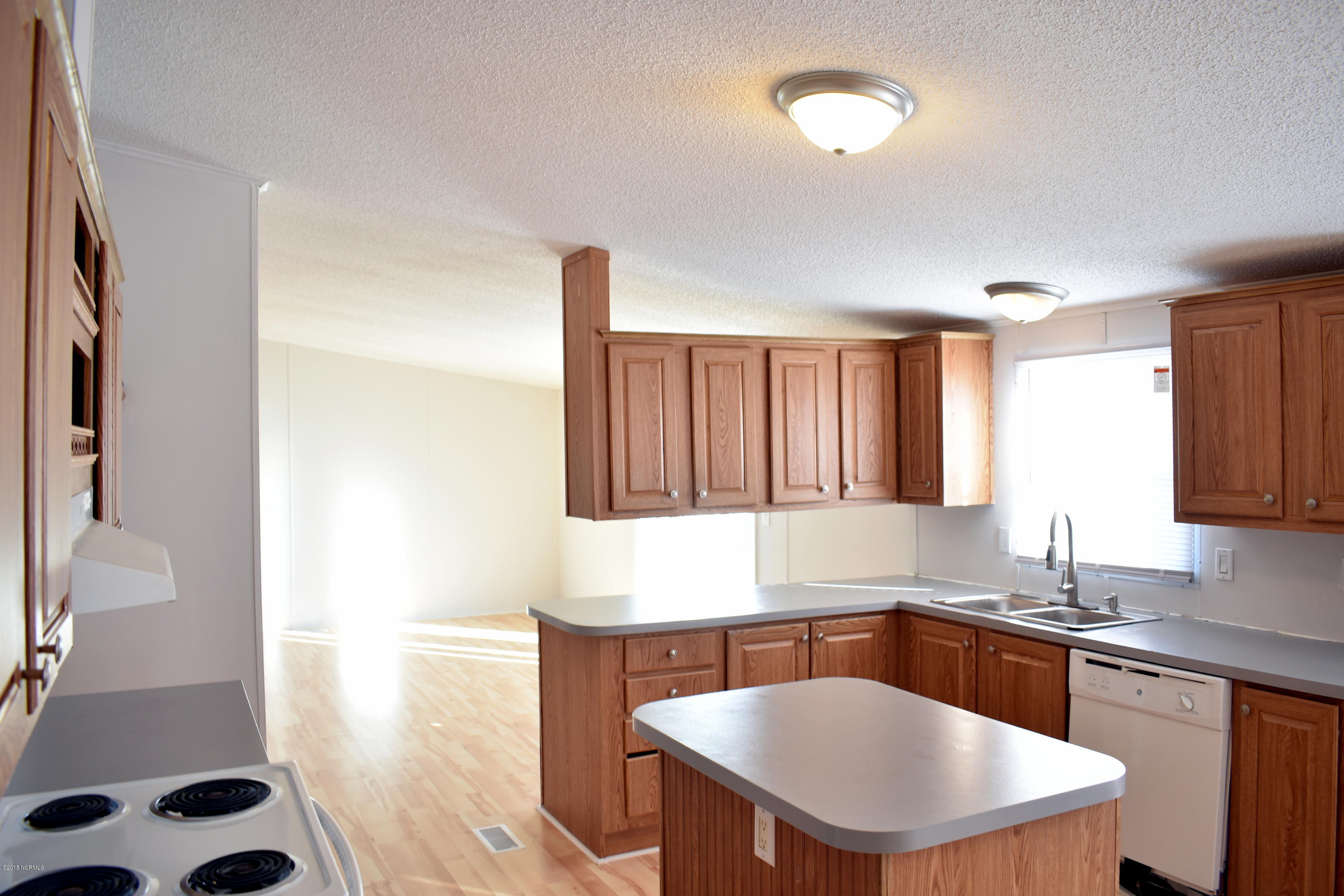 8629 Ransom Lane Kenly, NC 27542 - Photo 5 of 19 Tons of cabinets and counter space!