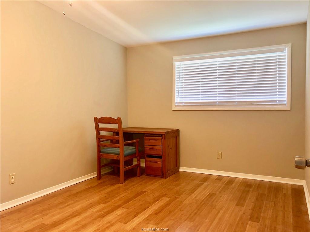 807 Vine Street Bryan, TX 77802 - Photo 13 of 17 a view of a workspace with furniture and a window