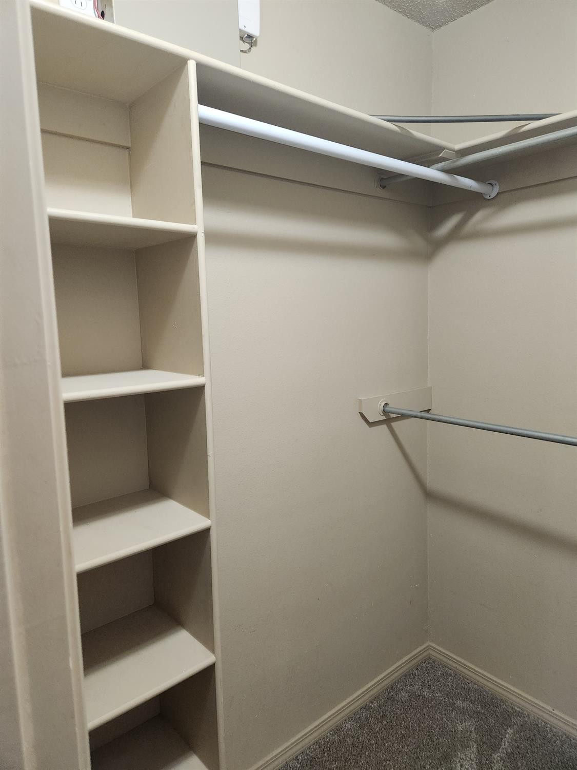 2109 21st Street, Unit 2 Lubbock, TX 79411 - Photo 11 of 21 a view of walk in closet with empty racks