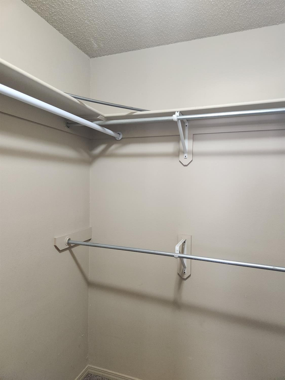 2109 21st Street, Unit 2 Lubbock, TX 79411 - Photo 12 of 21 a view of a room with racks on the wall