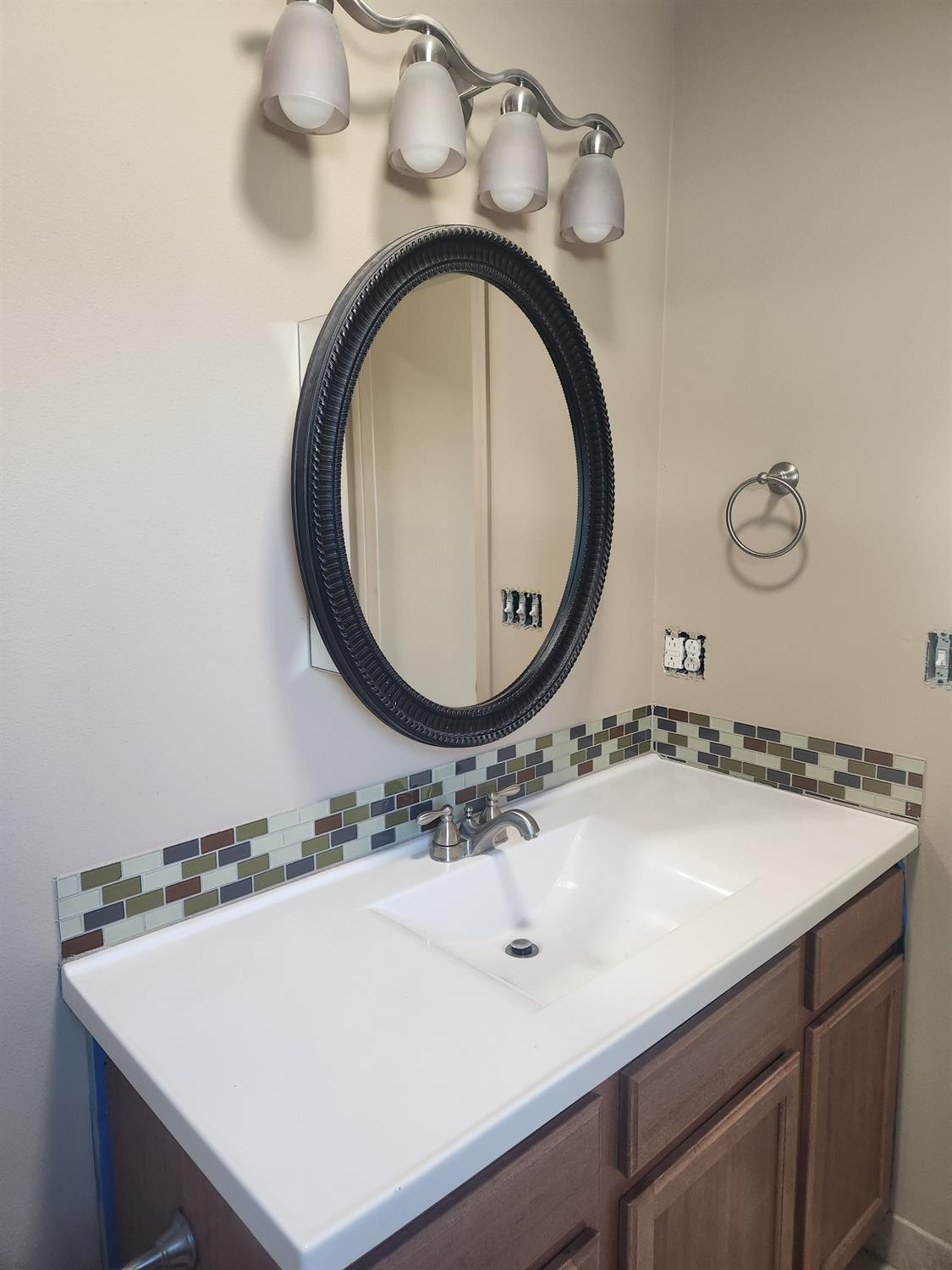 2109 21st Street, Unit 2 Lubbock, TX 79411 - Photo 13 of 21 a bathroom with a sink and a mirror