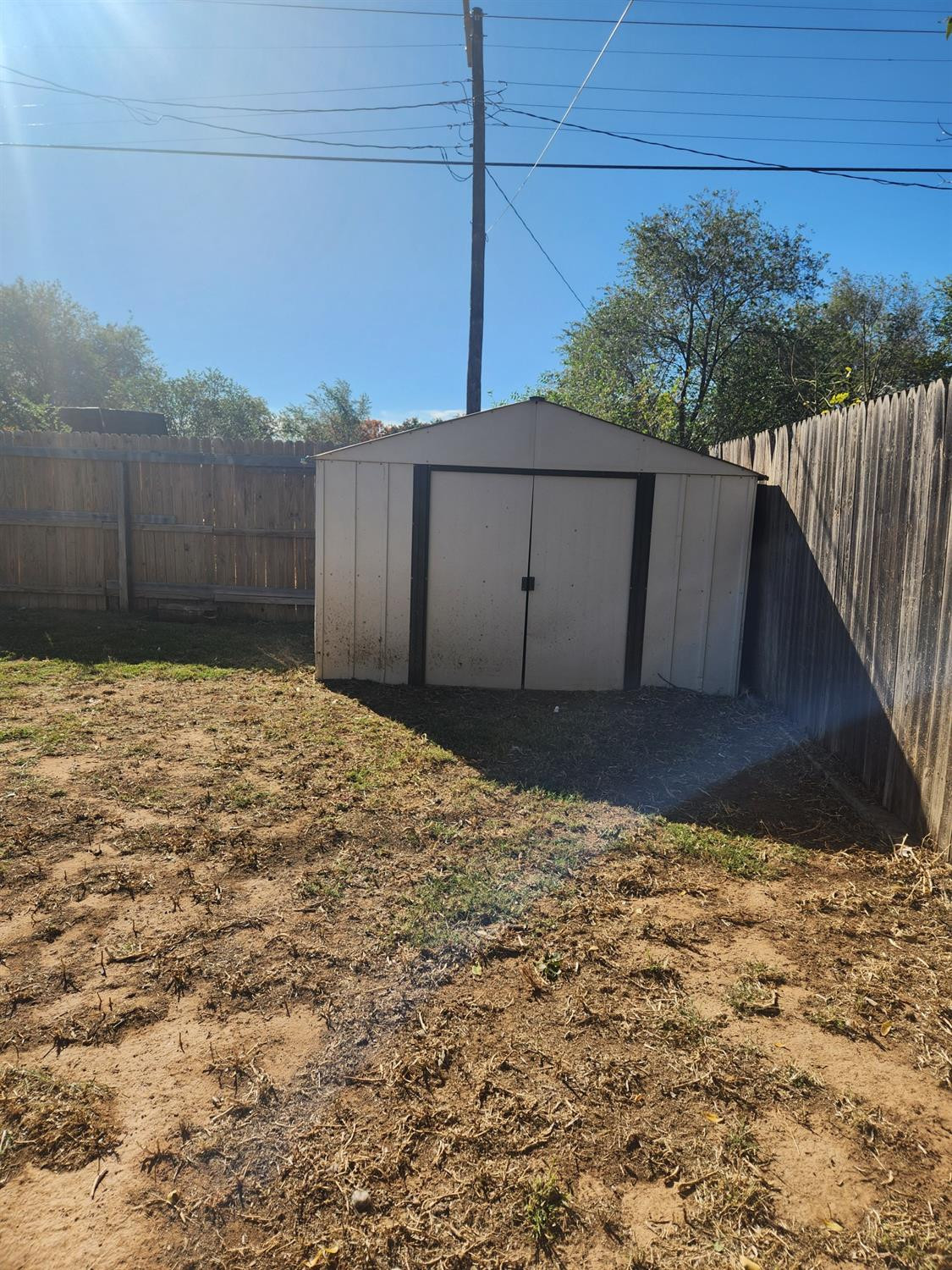2109 21st Street, Unit 2 Lubbock, TX 79411 - Photo 18 of 21 a view of a backyard