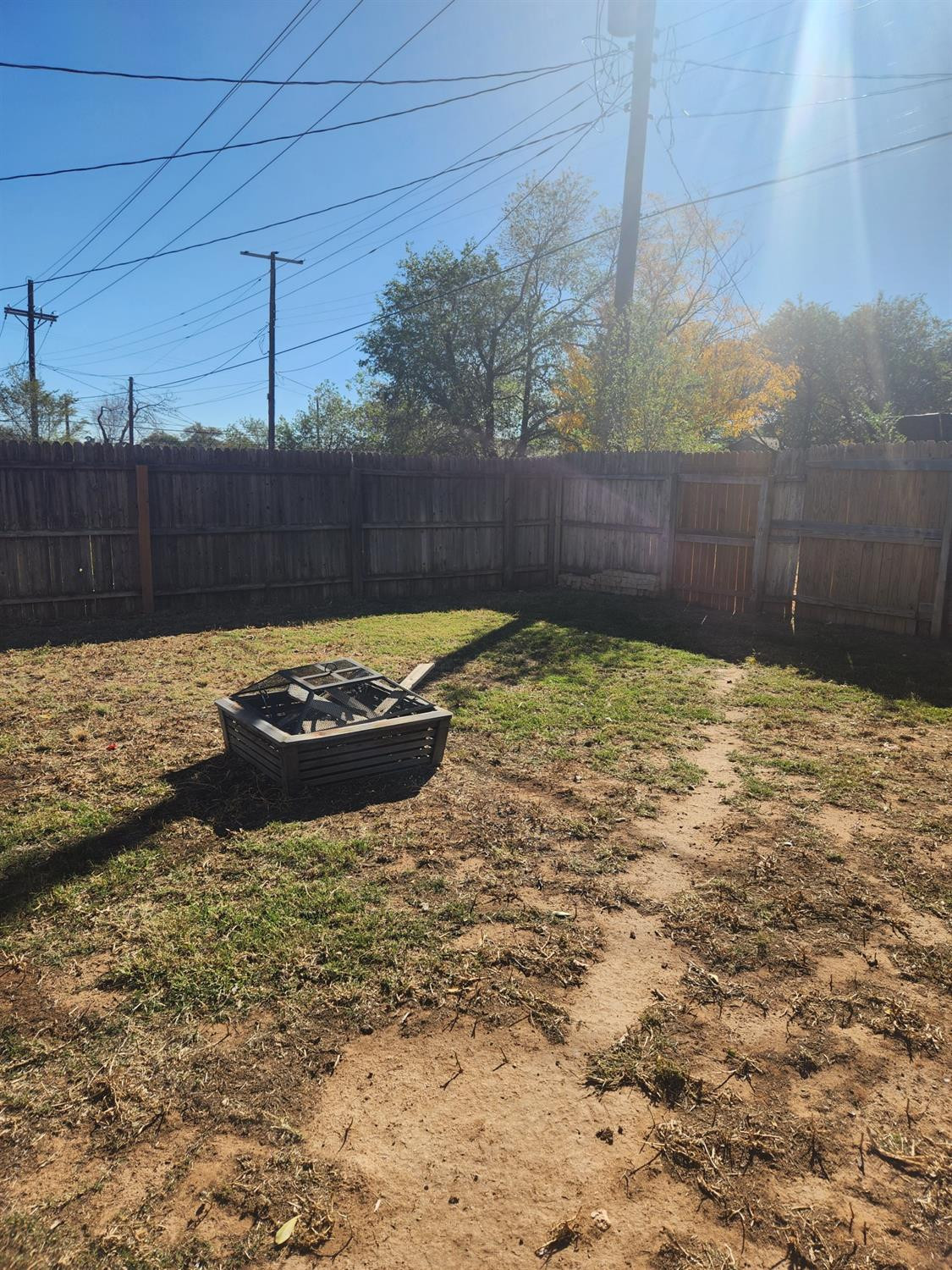 2109 21st Street, Unit 2 Lubbock, TX 79411 - Photo 19 of 21 a view of a backyard of the house