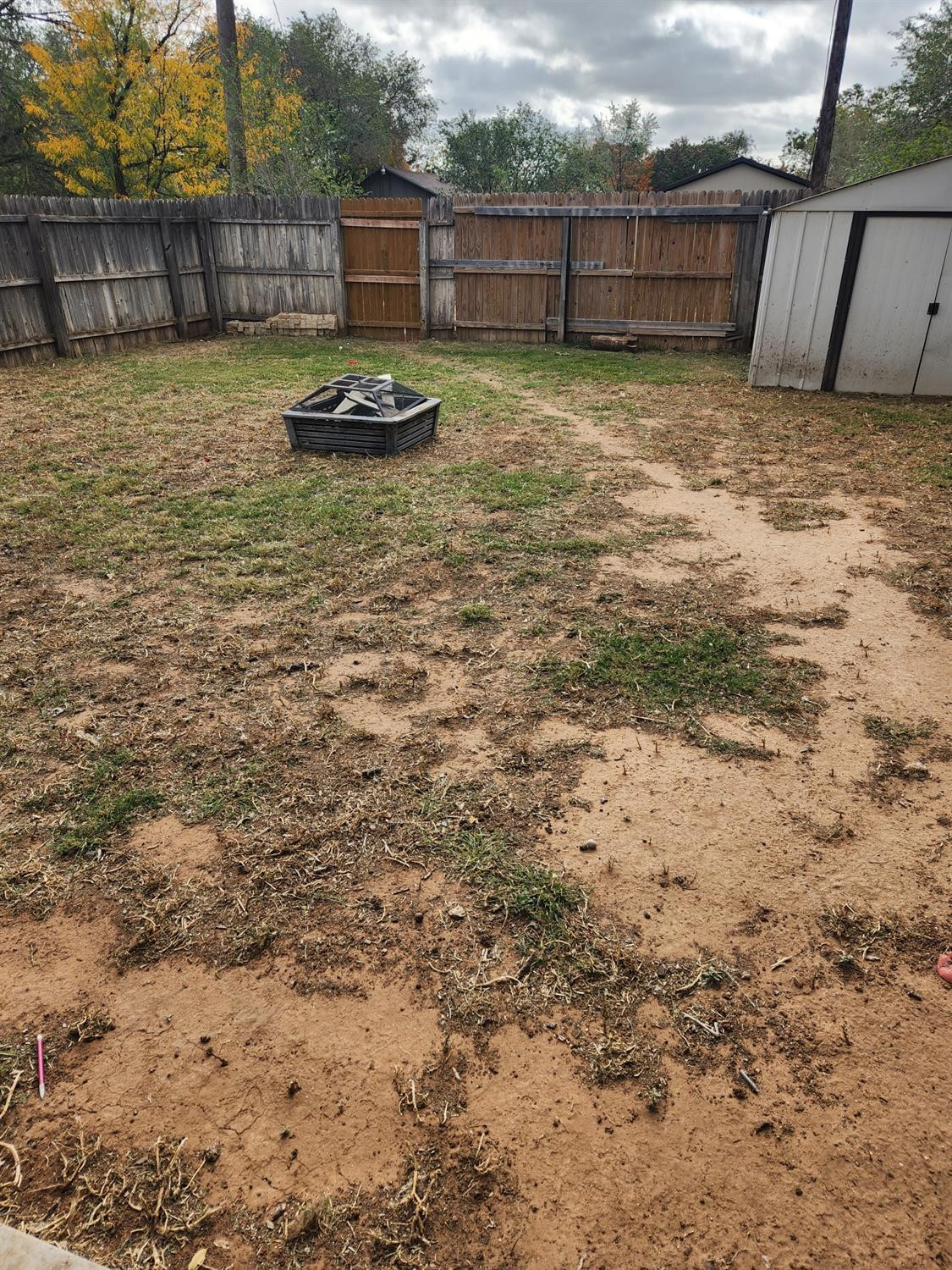2109 21st Street, Unit 2 Lubbock, TX 79411 - Photo 21 of 21 a view of a backyard with a small pool