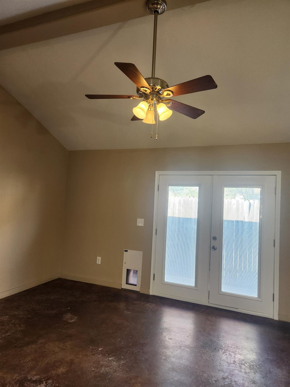 2109 21st Street, Unit 2 Lubbock, TX 79411 - Photo 4 of 21 a view of an empty room with a window and wooden floor