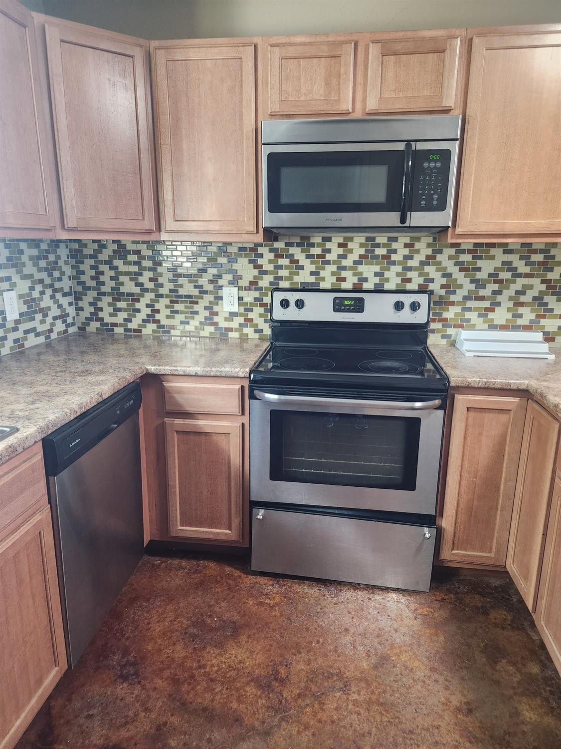 2109 21st Street, Unit 2 Lubbock, TX 79411 - Photo 5 of 21 a kitchen with granite countertop a stove microwave and sink
