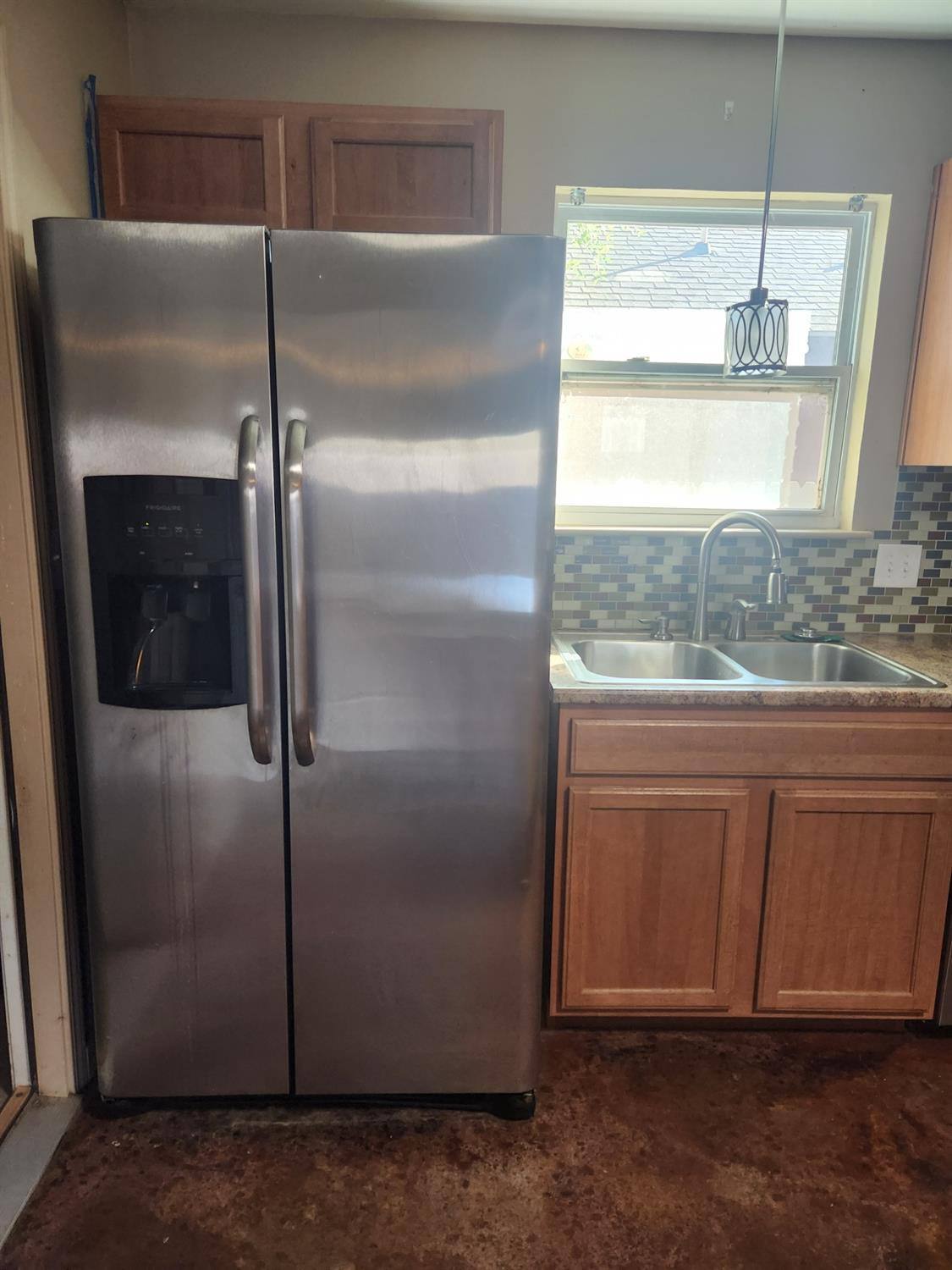 2109 21st Street, Unit 2 Lubbock, TX 79411 - Photo 6 of 21 a kitchen with stainless steel appliances granite countertop a refrigerator and a sink