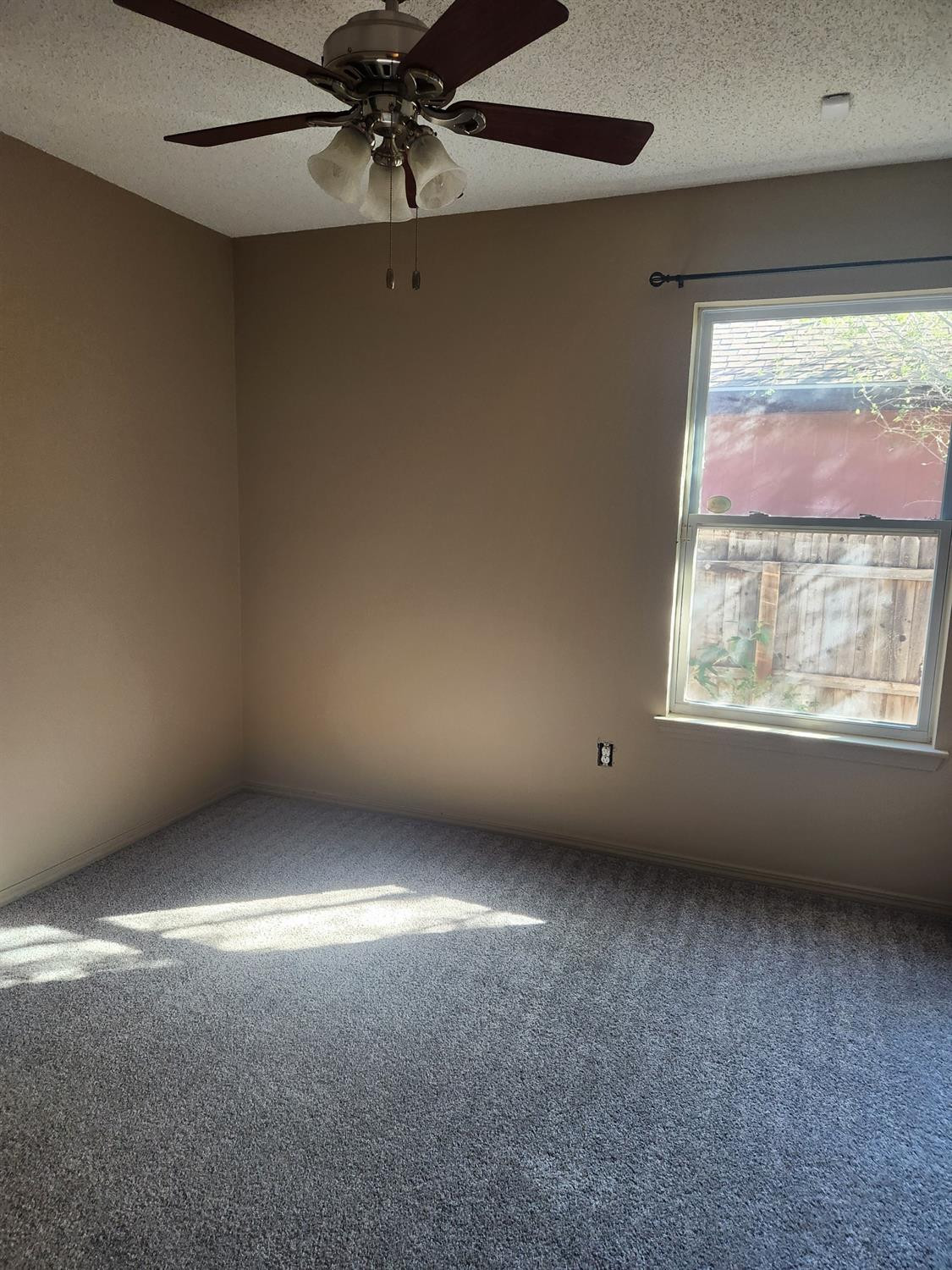 2109 21st Street, Unit 2 Lubbock, TX 79411 - Photo 9 of 21 a view of an empty room with a window