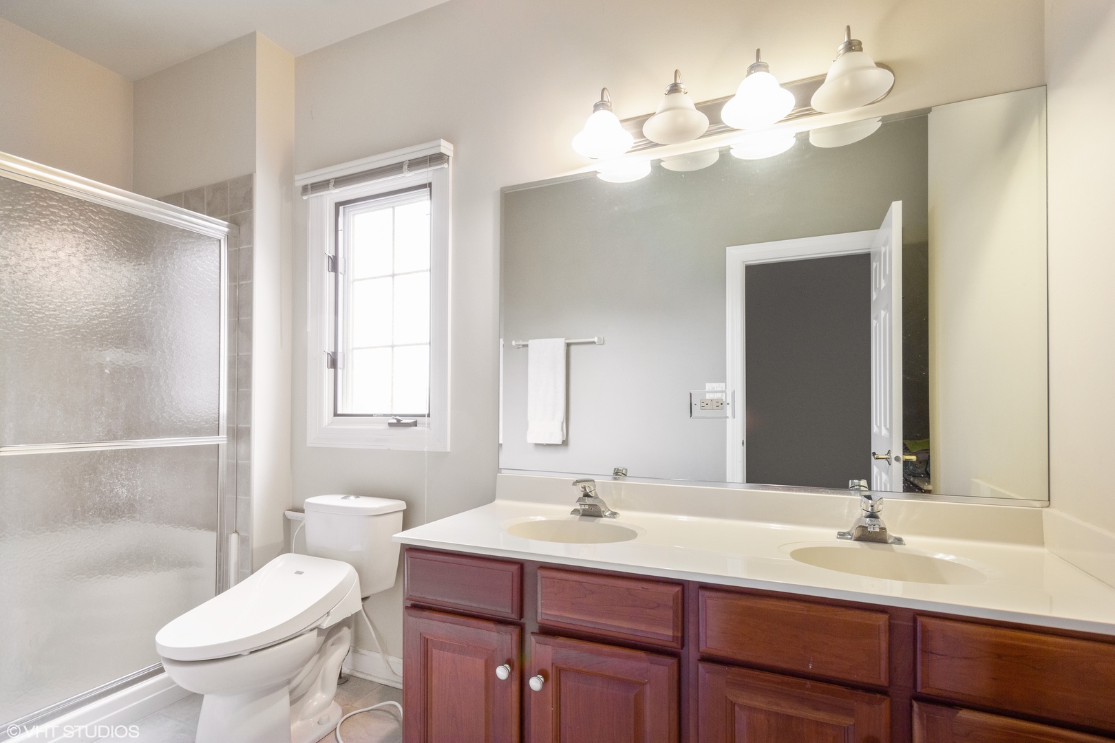 38 Long Cove Drive Lemont, IL 60439 - Photo 17 of 24 a bathroom with a sink vanity mirror and toilet