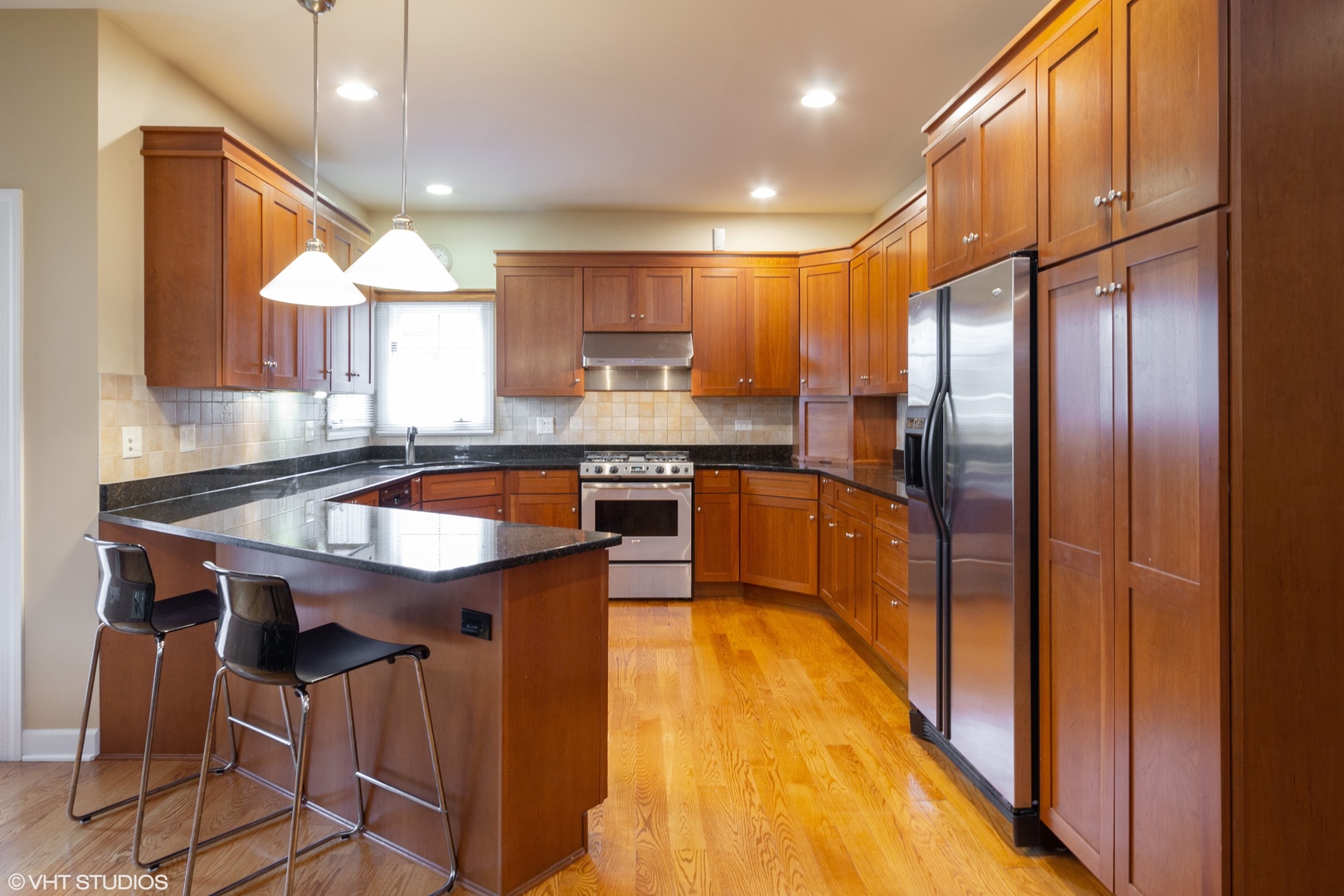 38 Long Cove Drive Lemont, IL 60439 - Photo 5 of 24 a kitchen with stainless steel appliances granite countertop counter space a sink and cabinets