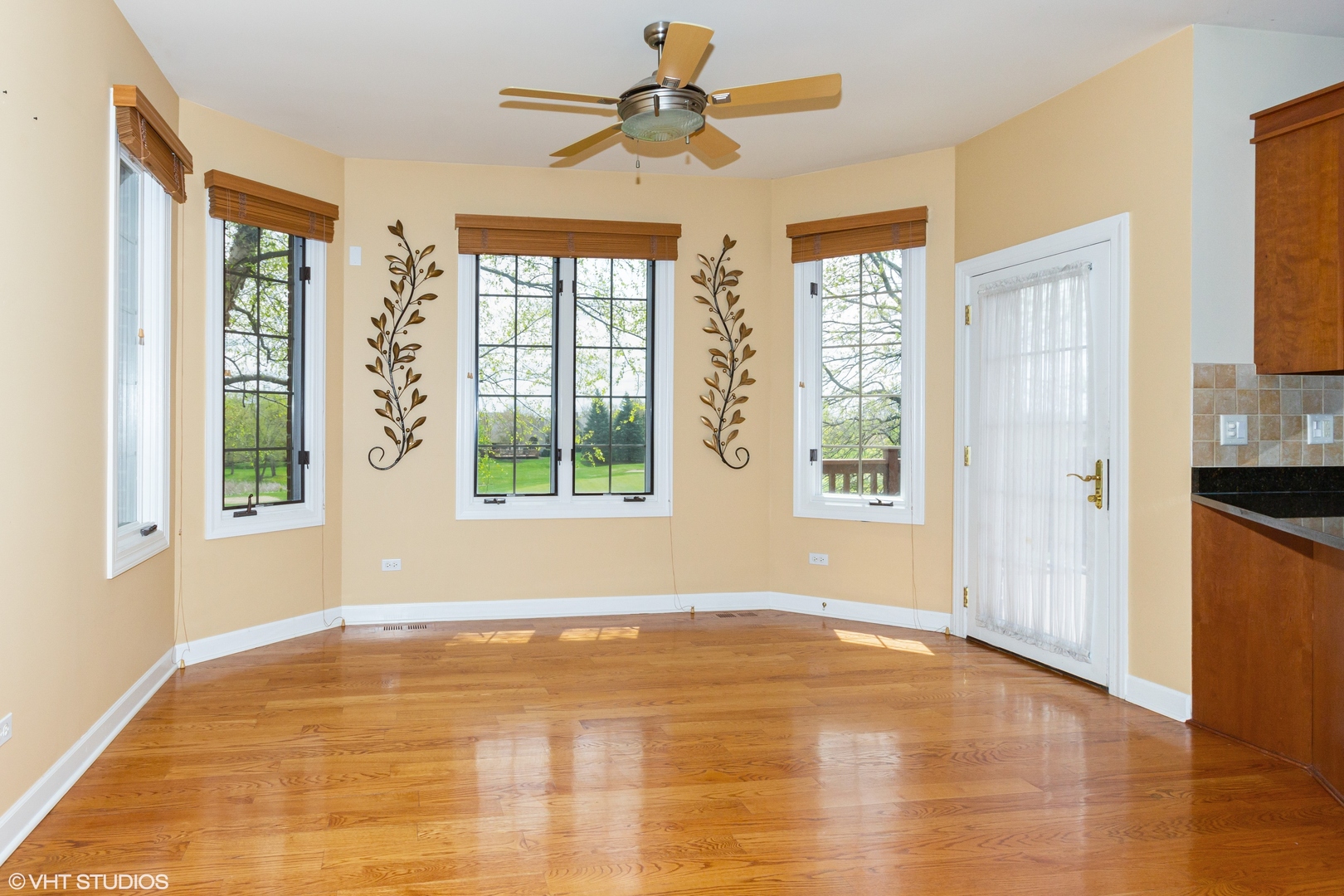 38 Long Cove Drive Lemont, IL 60439 - Photo 6 of 24 a view of an empty room with window and a kitchen