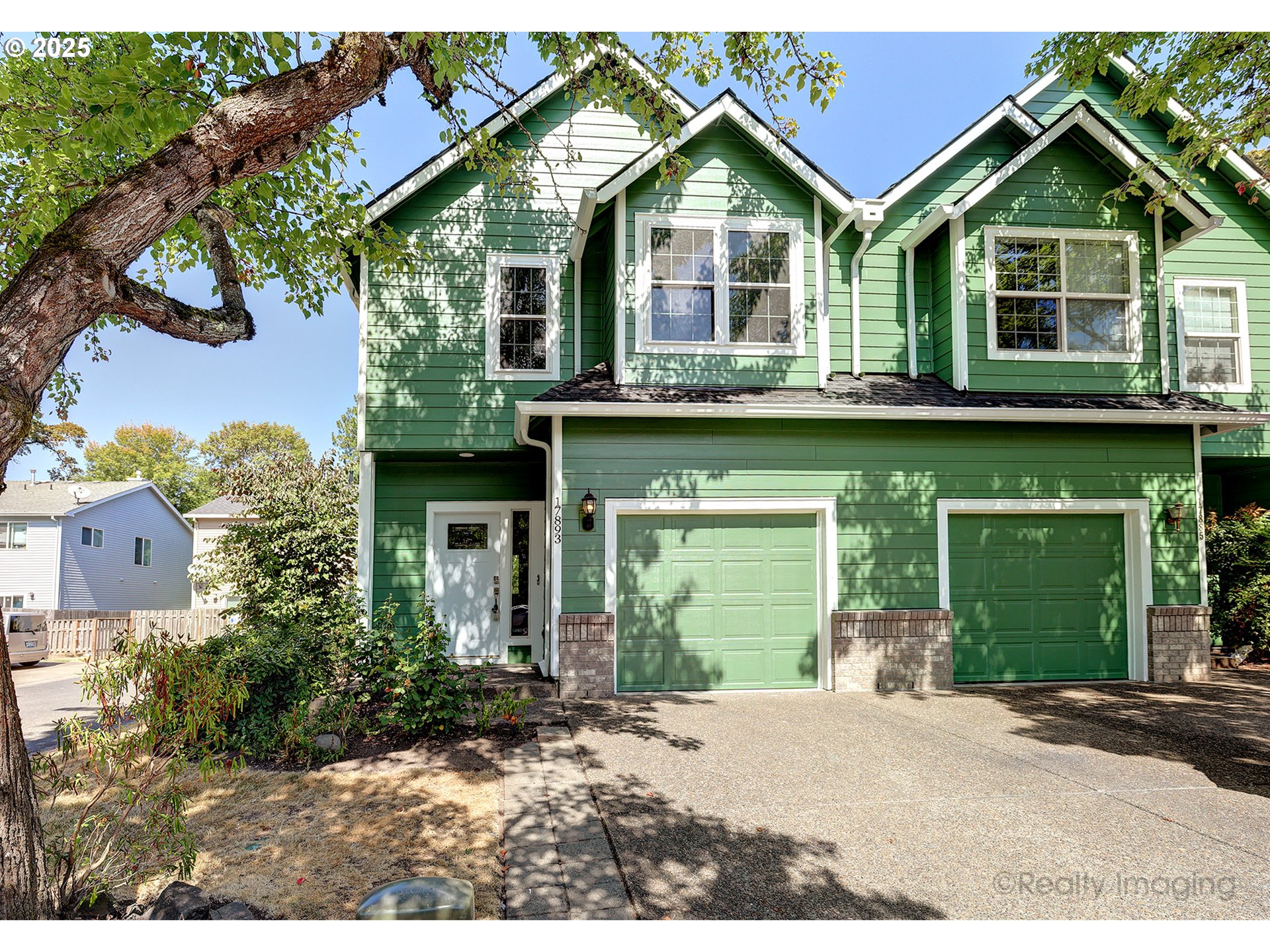 17893 Southwest Wakem Street Beaverton, OR 97003 - Photo 1 of 16 a front view of a house with a yard and garage