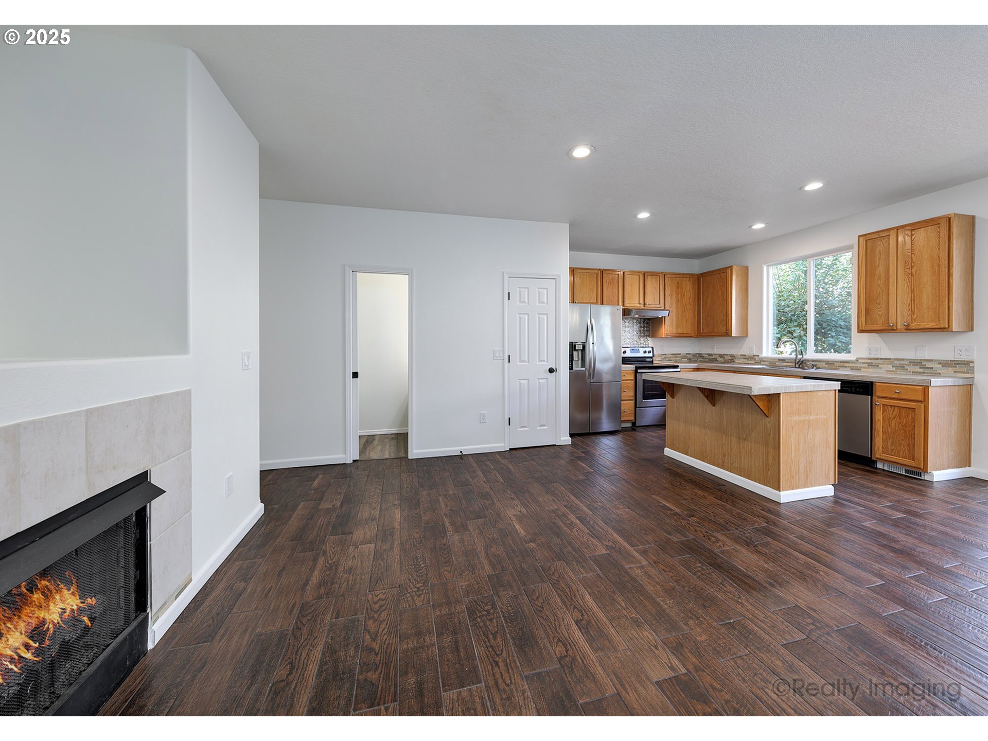 17893 Southwest Wakem Street Beaverton, OR 97003 - Photo 3 of 16 a view of kitchen with wooden floor and electronic appliances