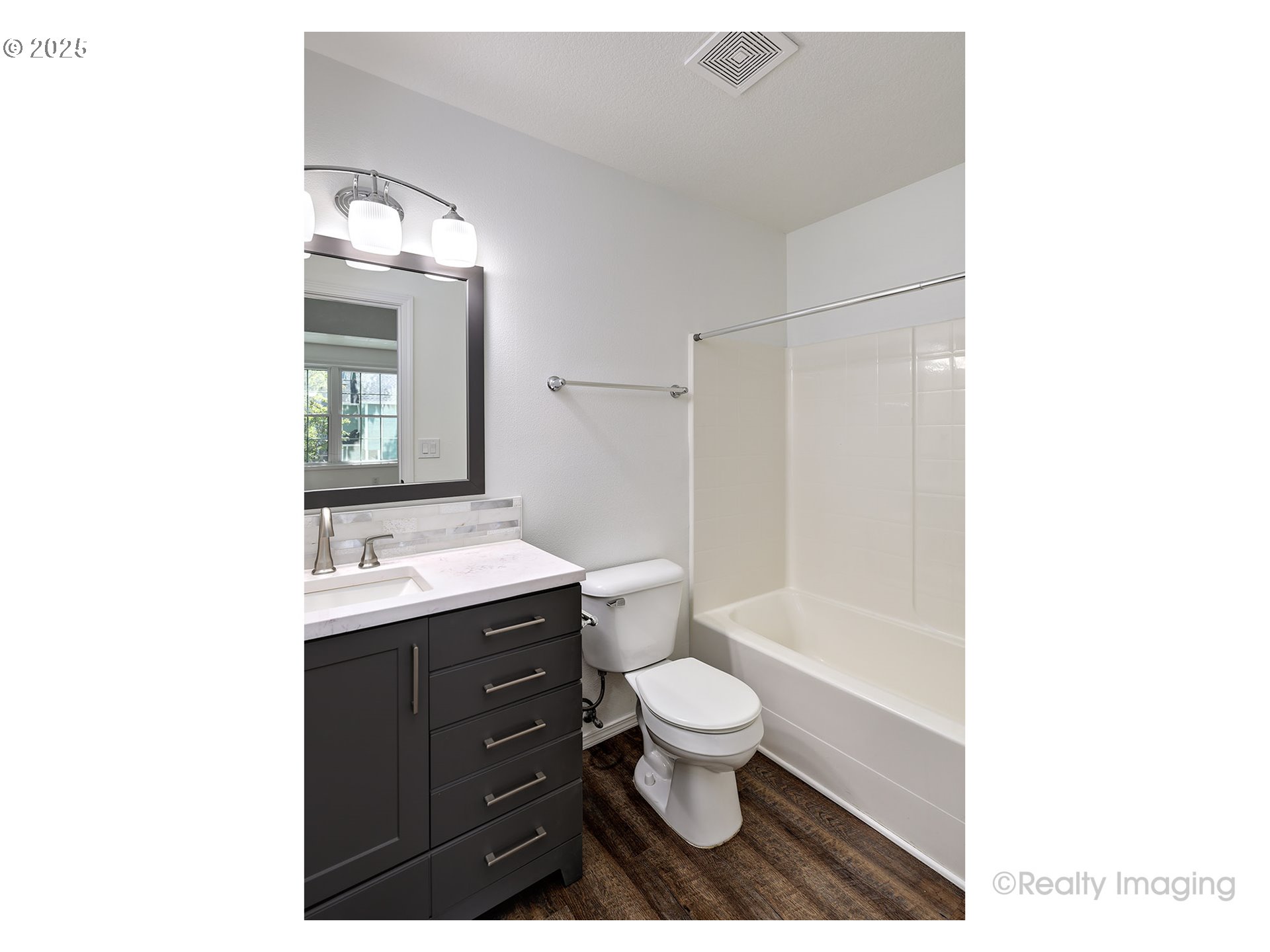 17893 Southwest Wakem Street Beaverton, OR 97003 - Photo 9 of 16 a bathroom with a toilet a sink and mirror
