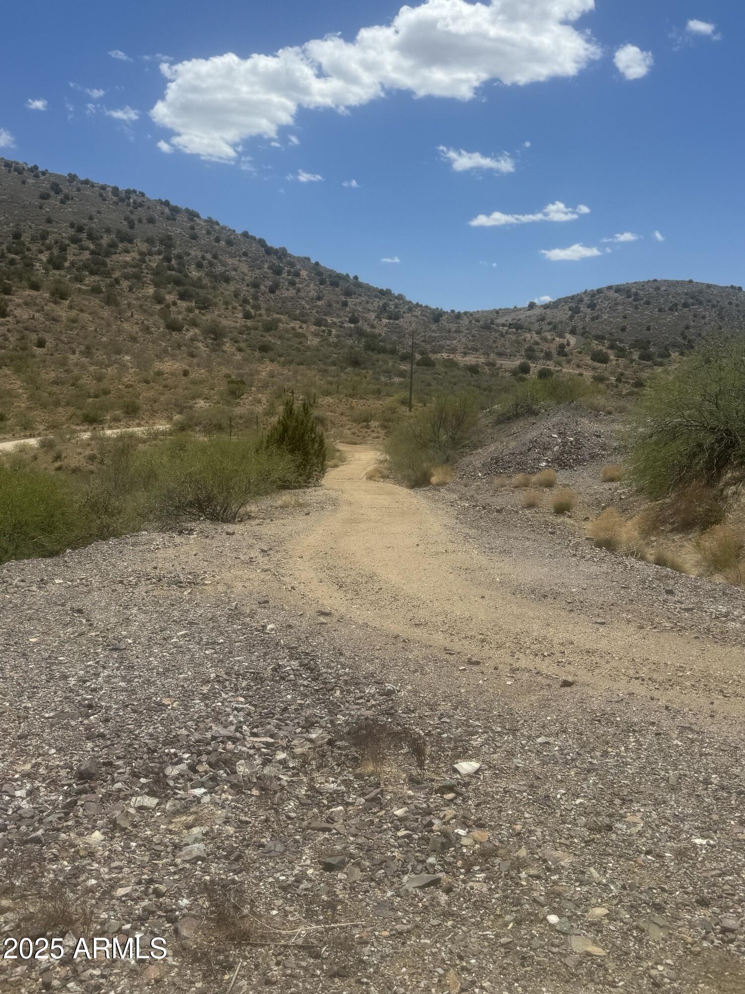 98 Copper Canyon Ranch Road Globe, AZ 85501 - Photo 1 of 20 a view of lake with mountain
