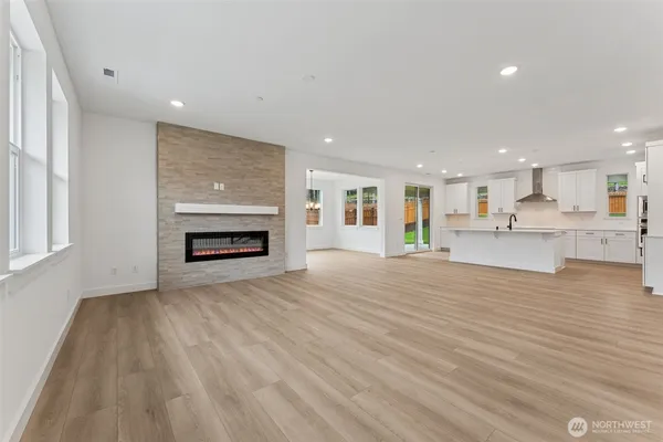 a view of kitchen and kitchen with furniture wooden floor