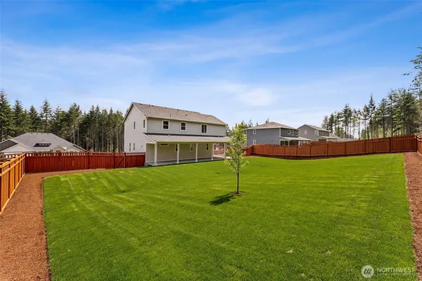 a view of a house with a big yard
