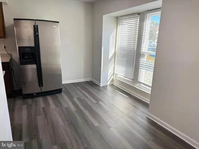a view of a room with wooden floor and gate
