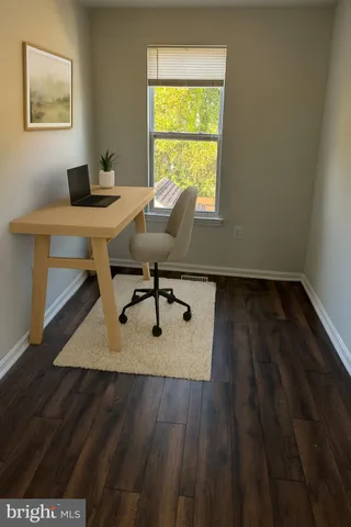 a workspace with furniture and window
