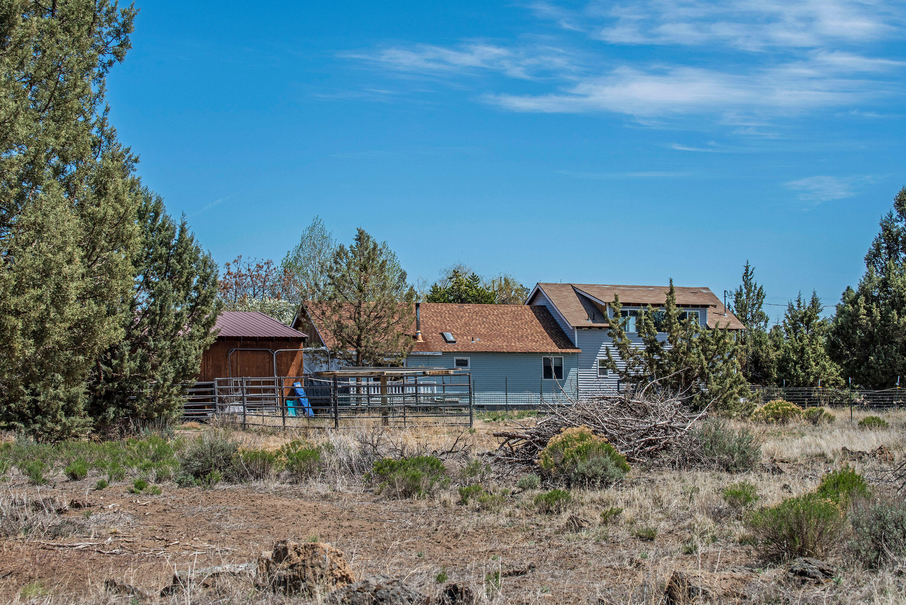 63591 Gentry Loop Bend, OR 97701 - Photo 22 of 24 a backyard of a house with lots of green space