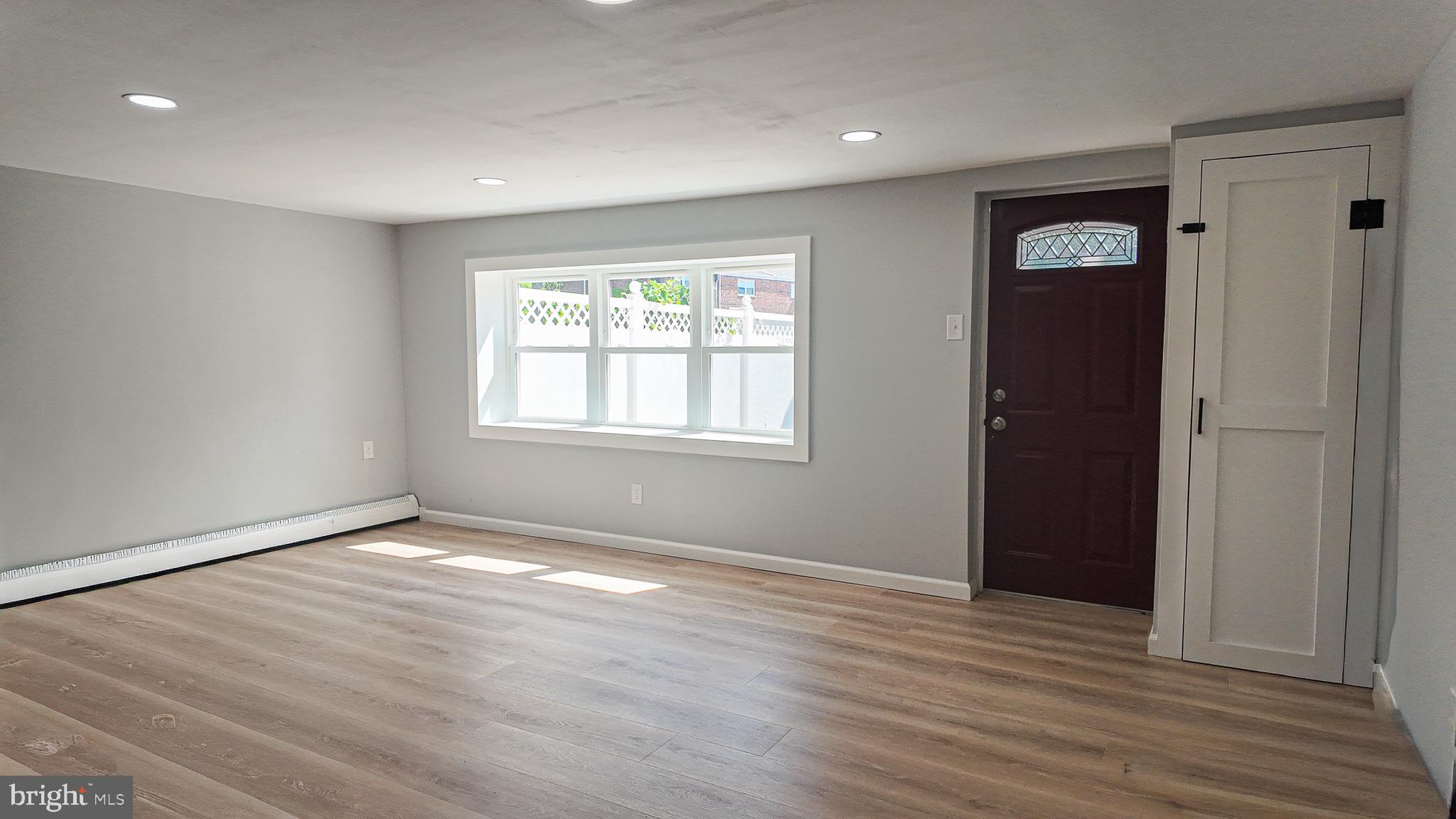 3503 Brookview Road Philadelphia, PA 19154 - Photo 27 of 30 a view of an empty room with wooden floor and a window